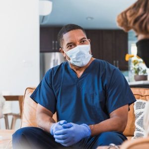 Portrait photo of an African American male nurse with a surgical mask